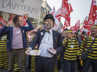 Protesters take part in a demonstration against austerity on April 12, 2014 in Paris.  The protest march against the government's austerity...