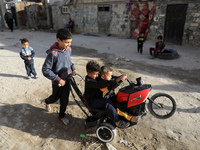 Palestinian children play next their house in Gaza City, Palestine, on April 12, 2022. (