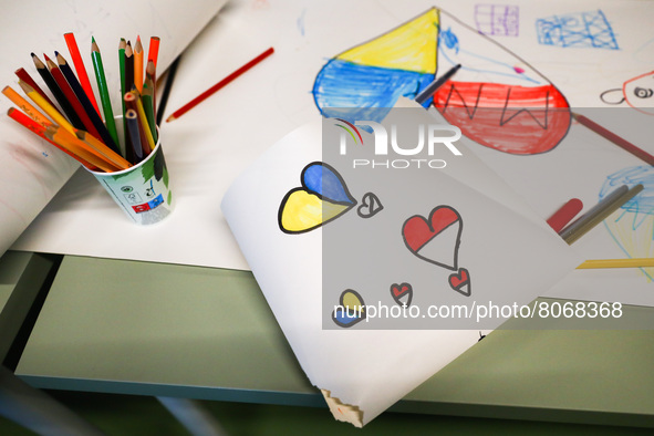 Ukrainian child's drawings at a cash enrolment centre opened by UNHCR for refugees from Ukraine who fled to Poland after Russian attack, at...
