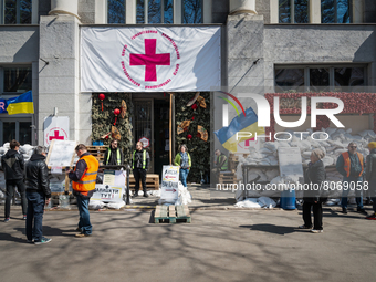 Ukrainian citizens are gathered in front of the Humanitarian Volounteer Center, temporary inside the Odessa Food Market in the city center o...