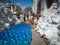 Water tanks are seen behind a barricade at the Humanitarian Volounteer Center, in the city  center of Odessa, Ukraine.(