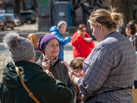 Ukrainian refugees are queuing for receiving help outside the local school n˚117 converted in the Huanitarian Volunteer Center, in the city...