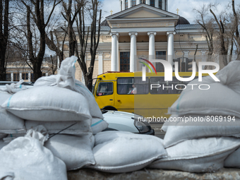 A local bus is seen passing in front of barricades made of cement blocks and sand bags, in the streets of the center in Odessa, Ukraine. (