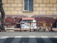 Sand bags are seen covering the window at the bottom of building in the streets of the center in Odessa, Ukraine. (