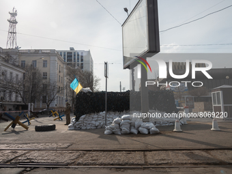 An Ukrainian soldier is seen standing in front of a check point in the streets of the center in Odessa, Ukraine. (