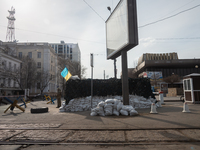 An Ukrainian soldier is seen standing in front of a check point in the streets of the center in Odessa, Ukraine. (