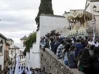 The image of Maria Santisima de la Aurora is seen in one of the narrowest streets of Albaicin neighborhood during the Maundy Thursday in Gra...