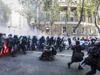 Rome, Italy – April 12, 2014: Demonstrators clash with police during an anti-austerity demonstration in Rome. Thousands protesters, from all...