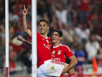 Benfica's forward Jonas  (L) celebrates his second goal with Benfica's forward Goncalo Guedes (R)   during the Portuguese League  football m...