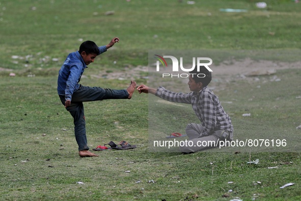 Kashmiri boys fight playfully in a ground in Sopore, Baramulla, Jammu and Kashmir, India on 15 April 2022. 