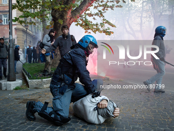 Clashes between police and protesters during an anti-austerity march in Rome, on April 12, 2014. Thousands of people gather to say no to the...