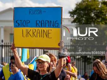 Demonstrators protest at the White House against the war in Ukraine.  In addition to the daily rally, demonstrators held a vigil outside the...