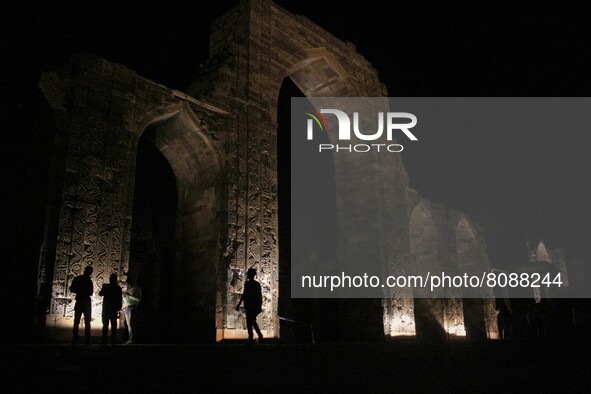 People visit the 13th century Qutub Minar complex, a UNESCO World Heritage site, on the eve of the 'World Heritage Day' in New Delhi, India...