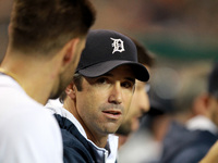 Detroit Tigers manager Brad Ausmus talk to J.D. Martinez during the third inning of a baseball game against the Minnesota twins in Detroit,...