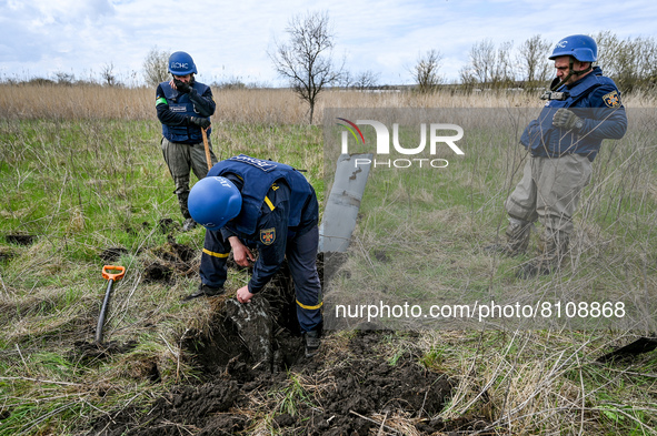 HRYHORIVKA, UKRAINE - APRIL 20, 2022 - Experts of a State Emergency Service bomb squad work to dispose of the remains of an Uragan rocket st...