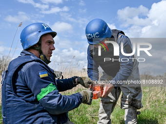 HRYHORIVKA, UKRAINE - APRIL 20, 2022 - Experts of a State Emergency Service bomb squad work to dispose of the dangerous remains of an Uragan...