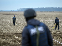 KYIV REGION, UKRAINE - APRIL 21, 2022 - EOD experts of the State Emergency Service scan the ground during a mine clearance mission near Berv...