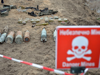 KYIV REGION, UKRAINE - APRIL 21, 2022 - Ammunition is arranged on the ground during a mine clearance mission near Bervytsia, a village liber...
