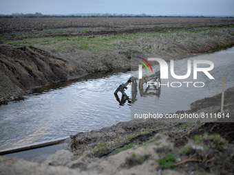 KYIV REGION, UKRAINE - APRIL 21, 2022 - The remains of a crossing are pictured in the Trubizh River near Bervytsia, a village liberated from...