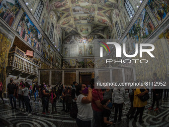 Visitors attend the exhibition of Michelangelo's work inside the replica of the Sistine Chapel installed in the zocalo of Mexico City. For t...