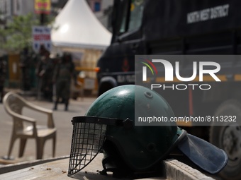 Helmet of a paramilitary trooper is kept on a cart at Jehangirpuri in New Delhi, India on 22 April 2022. Delhi police and paramilitary force...