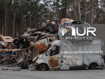 IRPIN, UKRAINE - APRIL 20, 2022 - Cars destroyed as a result of Russian shelling are piled at a parking lot in Irpin that was liberated from...