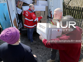 KYIV REGION, UKRAINE - APRIL 7, 2022 - Ukrainian Red Cross Society workers deliver humanitarian goods to the towns and cities liberated from...
