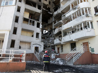 Rescue workers remove the rubble of a residential building which was hit by a missile strike in Odesa, Ukraine 24 April, 2022. On 23 April U...