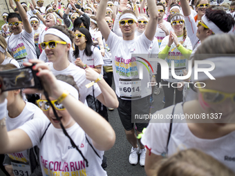 Runners during the Color Run race in Paris, on April 13, 2014. The Color Run is a five kilometres paint race without winners nor prizes, whi...