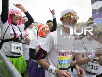 Runners during the Color Run race in Paris, on April 13, 2014. The Color Run is a five kilometres paint race without winners nor prizes, whi...