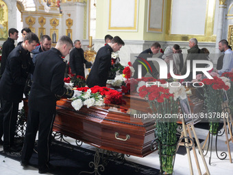 Ukrainians attend a funeral ceremony of 3 month-old Kira Glodan, her mother Valeriya Glodan and grandmother Ludmila Yavkina, at the Transfig...
