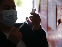 A nurse prepares a Covid-19 dose during a vaccination program in the local markets as attempt to reduce risk of contagion. On April 27, 2022...