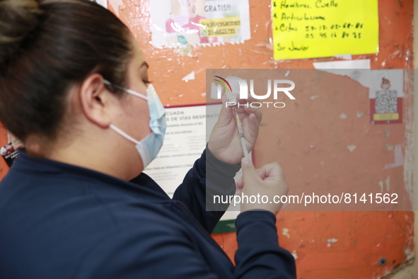 A nurse prepares a Covid-19 dose during a vaccination program in the local markets as attempt to reduce risk of contagion. On April 27, 2022...