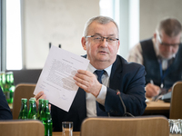 Andrzej Adamczyk (Minister of Infrastructure) shows the signed agreement during the parliamentary commission for air transport, in Warsaw, P...