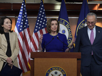 House Speaker Nancy Pelosi(D-CA)(center) alongside Senate Majority Leader Chuck Schumer(D-NY)(right) and Representative Maria Cantwell(D-WA)...
