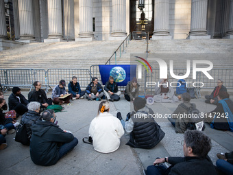 Activists held a vigil at the New York Supreme Court on April 29, 2022 for 50-year-old Wynn Bruce of Boulder, CO who set himself on fire, ta...