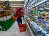 A woman shop at a supermarket in preparations ahead of Eid al-Fitr in Bogor, West Java, Indonesia on May 1, 2022. (