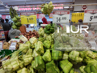 Coconut leaves used to make traditional rice cakes called 'Ketupat' in preparations ahead of Eid al-Fitr at a supermarket in Bogor, West Jav...