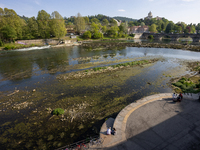 The opening of the dams to allow the cleaning of the river Po from the accumulation of algae in the central area of Turin creates an unreal...