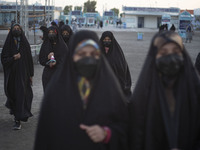 Veiled female worshipers arrive at Jamkaran's holy mosque to attend the Eid-al-Fitr mass prayers ceremony in the holy city of Qom 145 km (90...