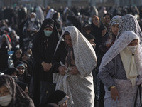 Iranian veiled women arrive at Jamkaran's holy mosque to attend the Eid-al-Fitr mass prayers ceremony in the holy city of Qom 145 km (90 mil...