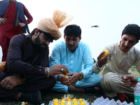 Afghans residing in India play a betting game with eggs as they celebrate the  Eid al-Fitr festivities, which marks the end of the holy fast...