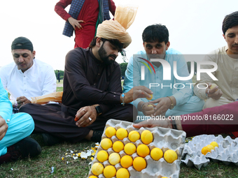 Afghans residing in India play a betting game with eggs as they celebrate the  Eid al-Fitr festivities, which marks the end of the holy fast...