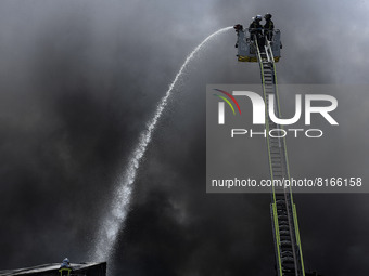 Firefighters battle blaze at meat warehouse in Getafe (Madrid) on 3rd May, 2022. (