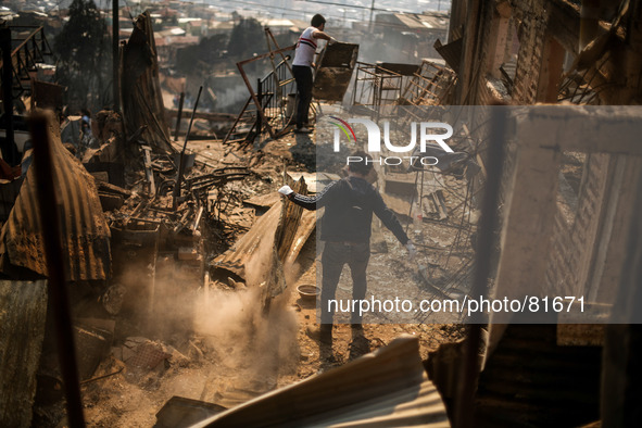 Intense fires consume a community on a hillside just outside Chile's coastal city of Valparaiso. More than 10,000 people were evacuated as a...