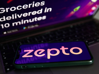 Zepto logo displayed on a phone screen and Zepto website displayed on a laptop screen are seen in this illustration photo taken in Krakow, P...
