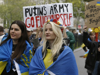 People walk to the World War Two Memorial following a  gathering in Lower Manhattan at a “Never Again” rally in support of Ukraine, on May 8...