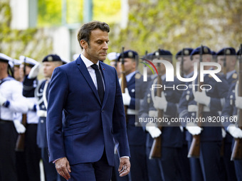 French President Emmanuel Macron reviews the guard of honour at the Chancellery in Berlin, Germany on May 9, 2022. (