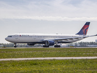 Delta Air Lines Airbus A330-300 aircraft as seen departing from Amsterdam Schiphol Airport AMS EHAM. The wide body A330 airplane has the reg...