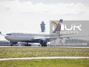 Delta Air Lines Airbus A330-300 aircraft as seen passing in front of the control tower while departing from Amsterdam Schiphol Airport AMS E...